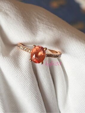 Natural heat treated 1.16 carat oval padparadscha sapphire ring - size 5 band